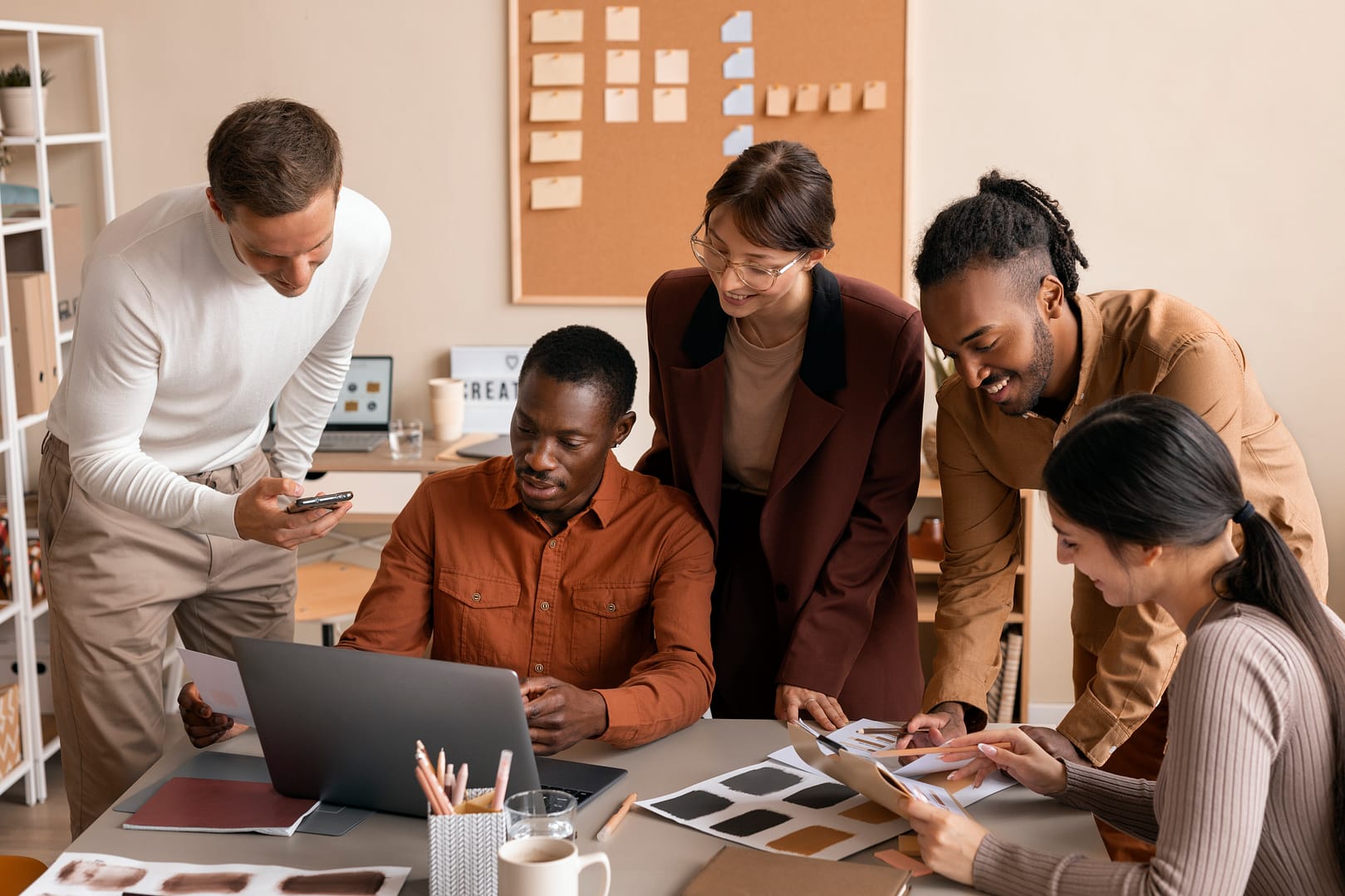 high-angle-smiley-colleagues-working-together